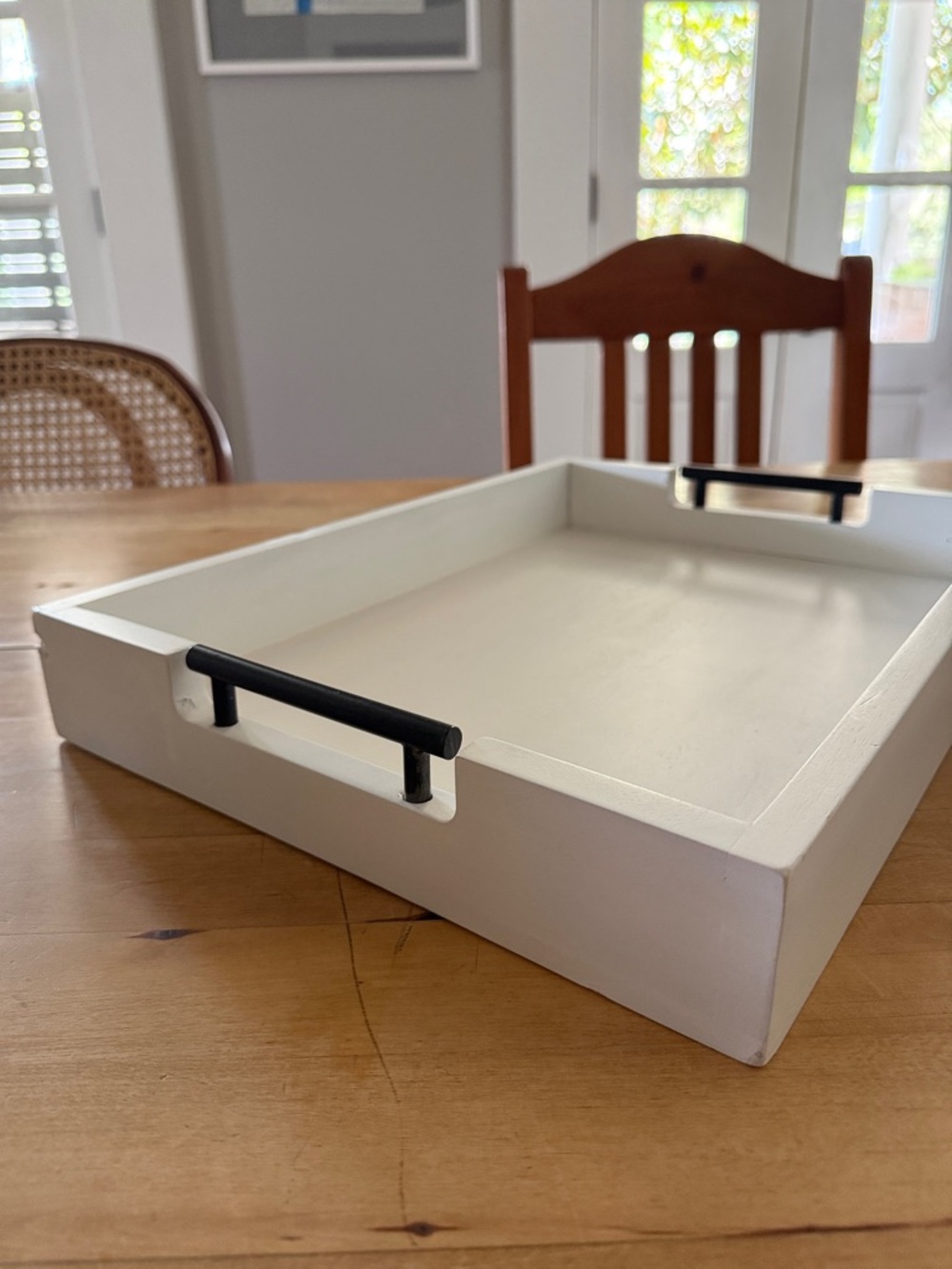 White Wooden Serving Tray with Black Handles. 16.5”x12.5”. New with some damage.